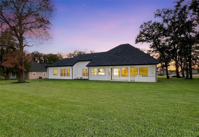 210 Hogan Ln, Hempstead, TX 77445 - back of property with a yard, a shingled roof, and stucco siding