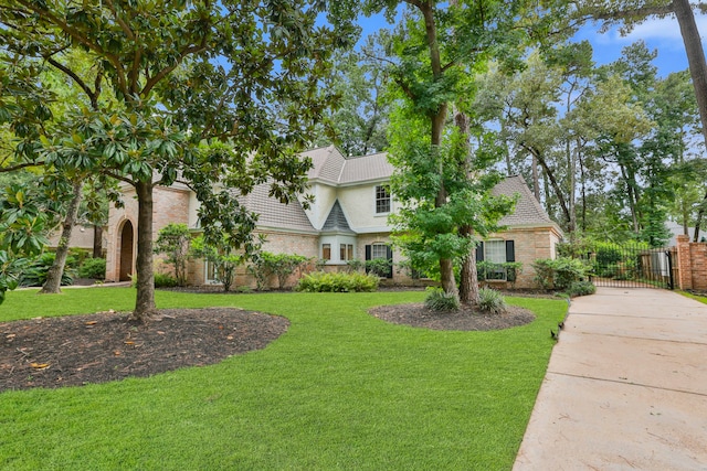 9327 Tranquil Park Dr, Spring, TX 77379 - view of front of house with a gate and brick siding