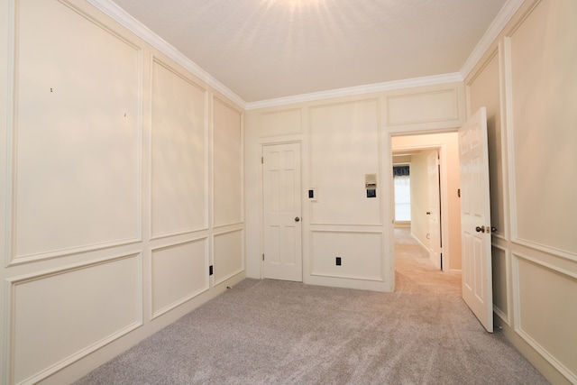 9327 Tranquil Park Dr, Spring, TX 77379 - empty room with light carpet, a decorative wall, and crown molding