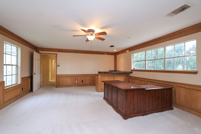 9327 Tranquil Park Dr, Spring, TX 77379 - unfurnished office with a wainscoted wall, a ceiling fan, crown molding, light colored carpet, and a decorative wall