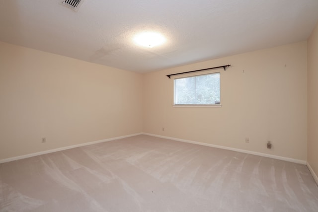 9327 Tranquil Park Dr, Spring, TX 77379 - unfurnished room with light carpet and a textured ceiling