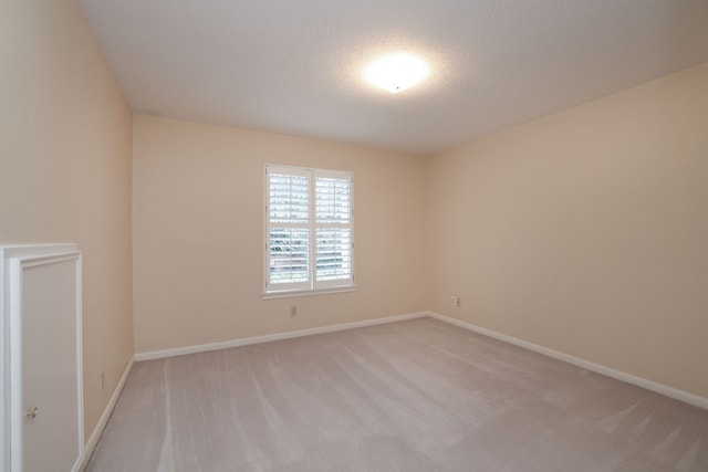 9327 Tranquil Park Dr, Spring, TX 77379 - unfurnished room featuring light carpet and baseboards