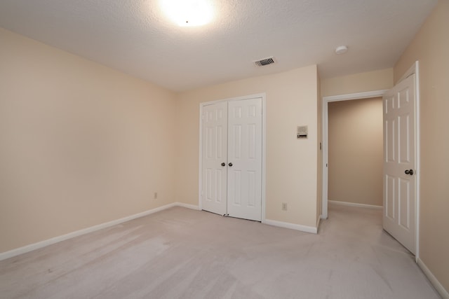 9327 Tranquil Park Dr, Spring, TX 77379 - unfurnished bedroom with a closet and light colored carpet