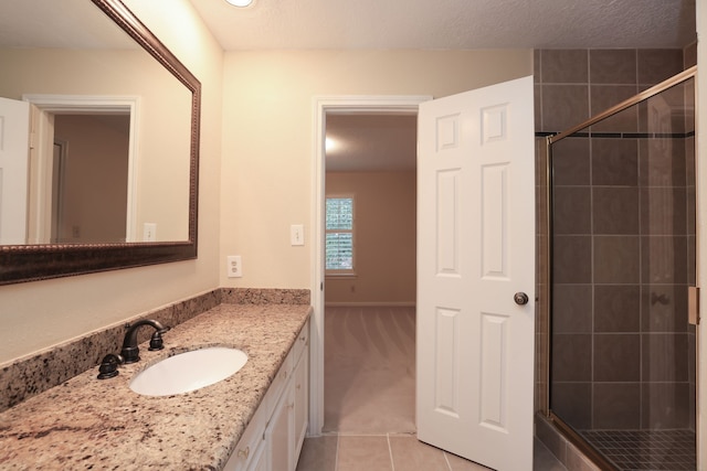 9327 Tranquil Park Dr, Spring, TX 77379 - full bathroom featuring a shower stall, vanity, and tile patterned flooring
