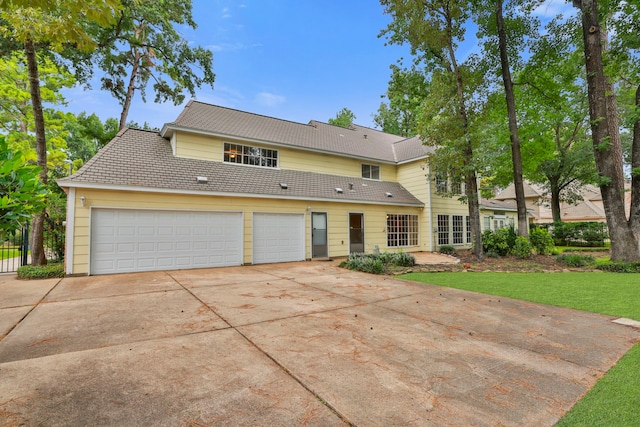9327 Tranquil Park Dr, Spring, TX 77379 - traditional-style home with driveway and a garage