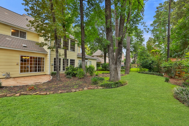 9327 Tranquil Park Dr, Spring, TX 77379 - view of grassy yard with a patio area