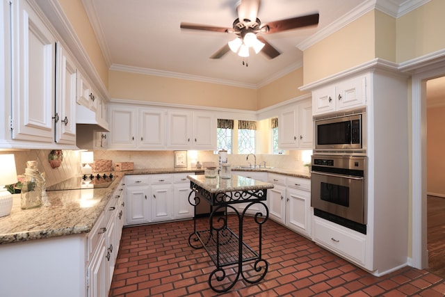 9327 Tranquil Park Dr, Spring, TX 77379 - kitchen with stainless steel appliances, brick flooring, white cabinetry, decorative backsplash, and ornamental molding