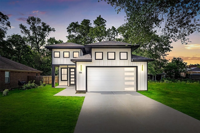 316 E Oakdale St, Dayton, TX 77535 - view of front facade with board and batten siding, a shingled roof, driveway, and a garage