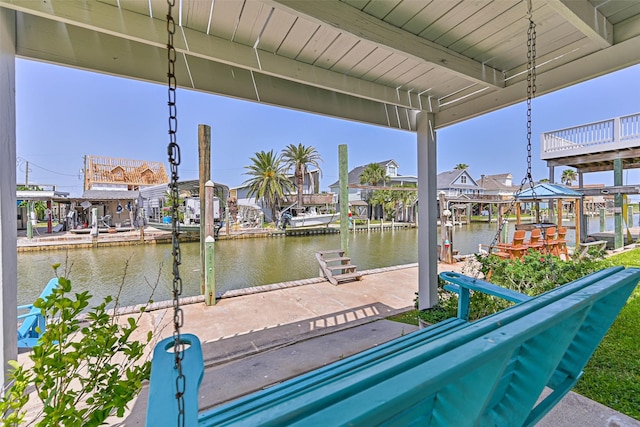 34 Tarpon Ln, Freeport, TX 77541 - dock area featuring a water view, boat lift, and a residential view