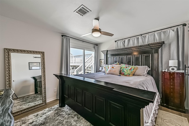 34 Tarpon Ln, Freeport, TX 77541 - bedroom with wood finished floors and a ceiling fan