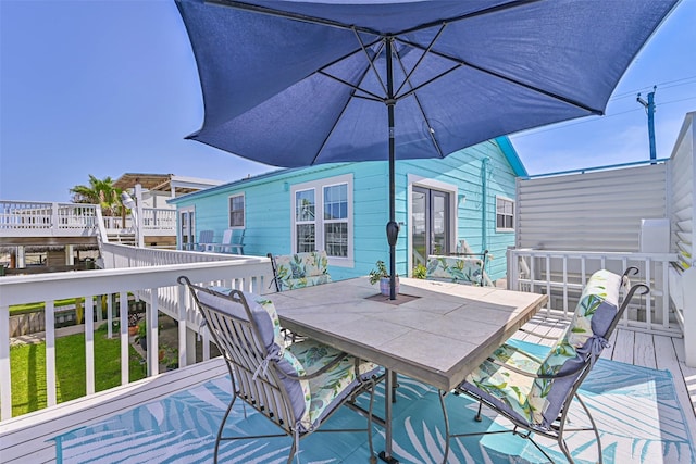 34 Tarpon Ln, Freeport, TX 77541 - deck with outdoor dining area