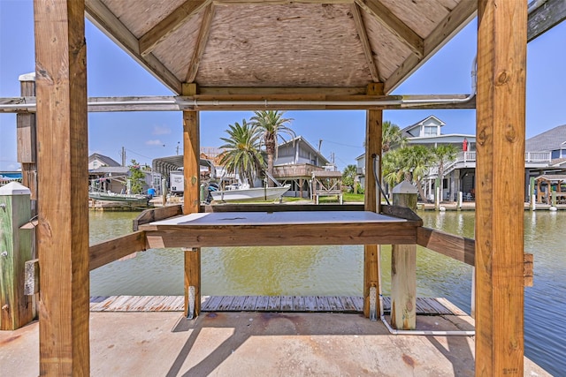 34 Tarpon Ln, Freeport, TX 77541 - view of patio / terrace featuring a water view, a gazebo, a boat dock, and a residential view