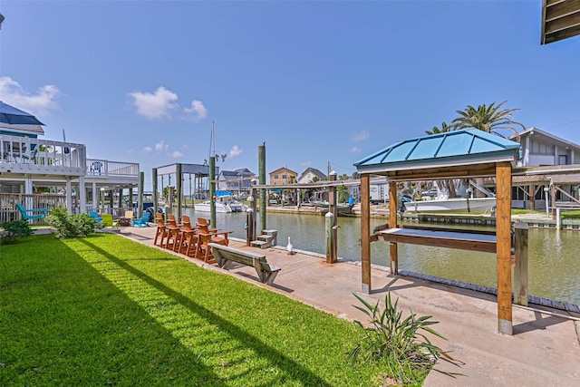 34 Tarpon Ln, Freeport, TX 77541 - dock featuring a yard and a water view
