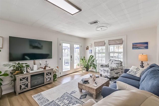 34 Tarpon Ln, Freeport, TX 77541 - living room with wood finished floors and french doors