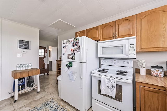 34 Tarpon Ln, Freeport, TX 77541 - kitchen featuring white appliances and brown cabinetry