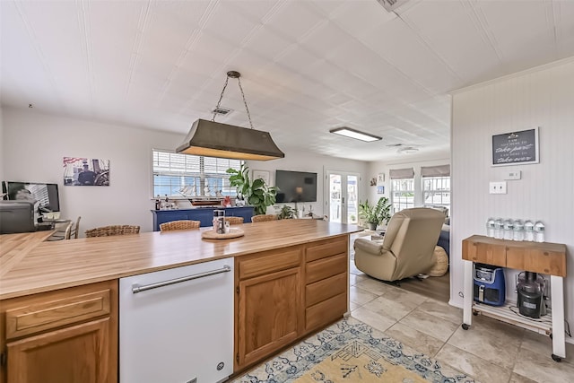 34 Tarpon Ln, Freeport, TX 77541 - kitchen featuring open floor plan, wood counters, dishwasher, and light tile patterned flooring