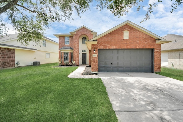 7427 Oakwood Canyon Dr, Cypress, TX 77433 - traditional-style home with brick siding, concrete driveway, a front yard, and an attached garage