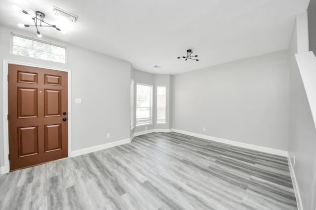 7427 Oakwood Canyon Dr, Cypress, TX 77433 - entryway with a chandelier and light wood-style flooring
