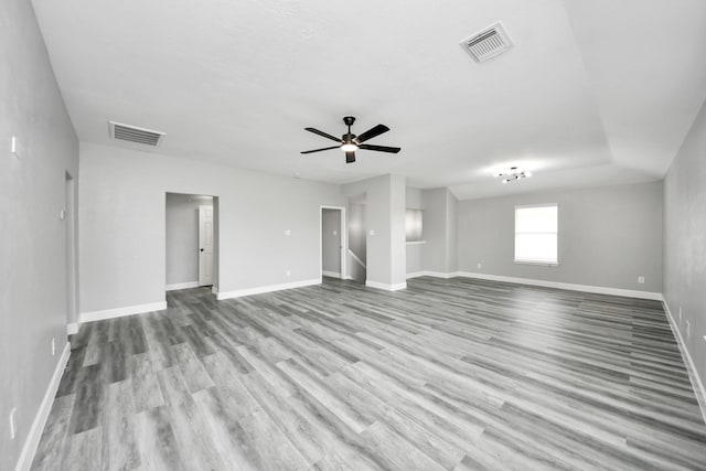 7427 Oakwood Canyon Dr, Cypress, TX 77433 - unfurnished living room featuring wood finished floors and ceiling fan
