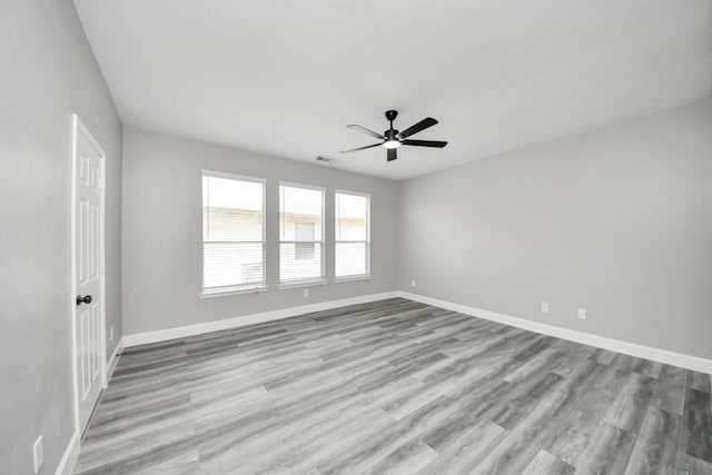7427 Oakwood Canyon Dr, Cypress, TX 77433 - empty room with ceiling fan and wood finished floors
