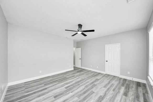 7427 Oakwood Canyon Dr, Cypress, TX 77433 - unfurnished bedroom featuring light wood-type flooring and ceiling fan