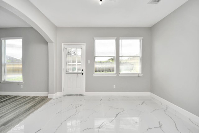 7427 Oakwood Canyon Dr, Cypress, TX 77433 - entryway featuring arched walkways and marble finish flooring