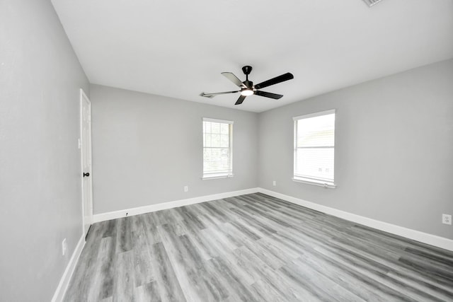 7427 Oakwood Canyon Dr, Cypress, TX 77433 - unfurnished room with a ceiling fan and wood finished floors