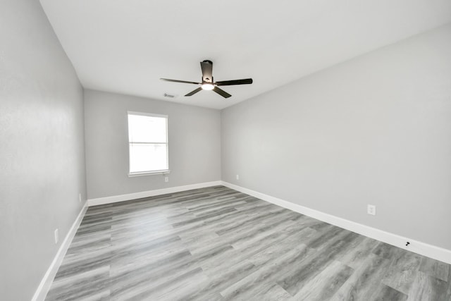 7427 Oakwood Canyon Dr, Cypress, TX 77433 - spare room with a ceiling fan and wood finished floors
