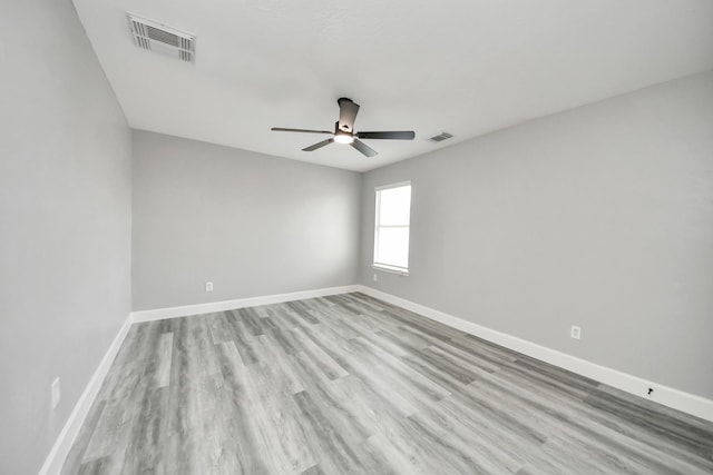 7427 Oakwood Canyon Dr, Cypress, TX 77433 - empty room featuring ceiling fan and wood finished floors