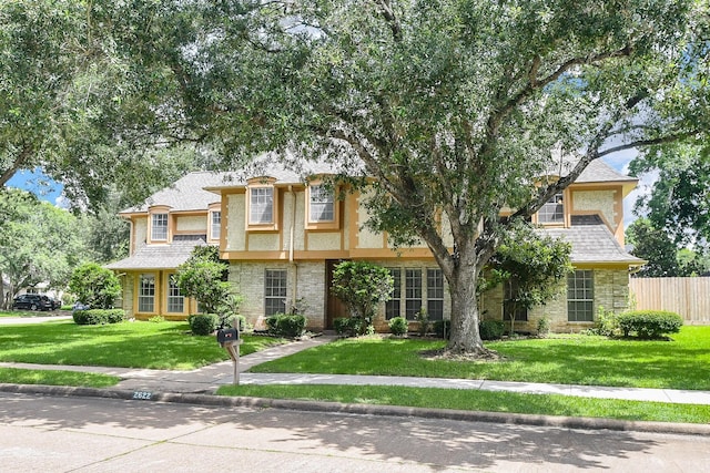 2622 Williams Grant St, Sugar Land, TX 77479 - view of front facade featuring stucco siding, brick siding, and a shingled roof