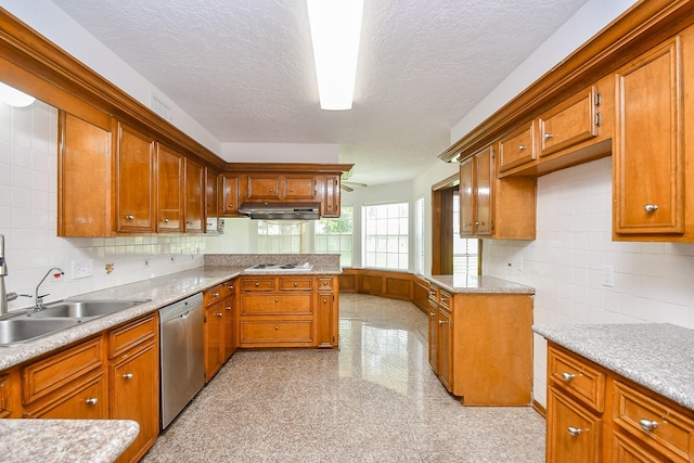 2622 Williams Grant St, Sugar Land, TX 77479 - kitchen with stainless steel dishwasher, under cabinet range hood, light countertops, a peninsula, and a textured ceiling
