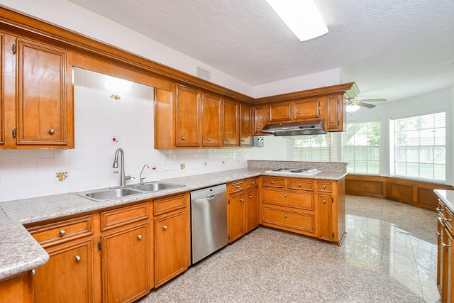 2622 Williams Grant St, Sugar Land, TX 77479 - kitchen featuring dishwasher, brown cabinetry, under cabinet range hood, light countertops, and a textured ceiling