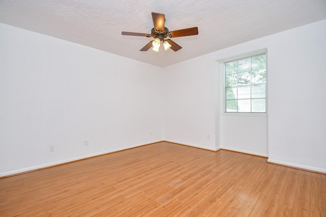 2622 Williams Grant St, Sugar Land, TX 77479 - unfurnished room with light wood-type flooring, ceiling fan, and a textured ceiling