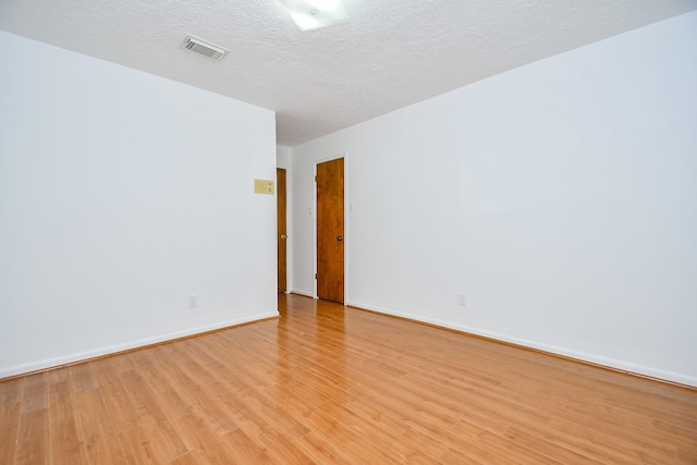 2622 Williams Grant St, Sugar Land, TX 77479 - empty room with light wood-style floors and a textured ceiling