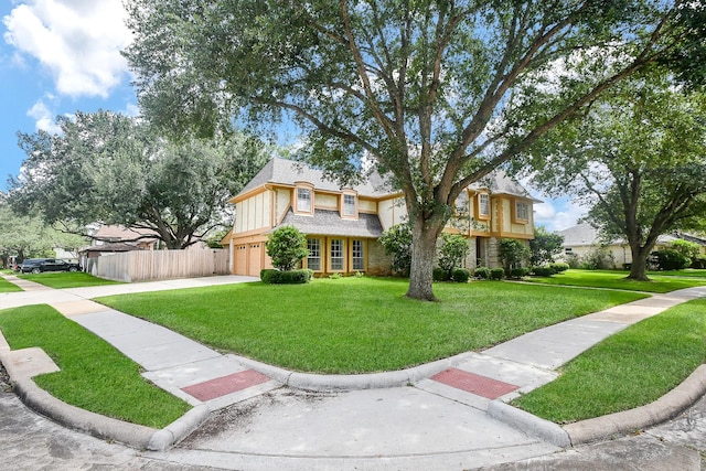 2622 Williams Grant St, Sugar Land, TX 77479 - tudor-style house with concrete driveway and a garage