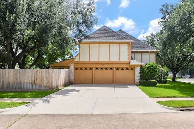 2622 Williams Grant St, Sugar Land, TX 77479 - view of front of house featuring concrete driveway, an attached garage, roof with shingles, and stucco siding