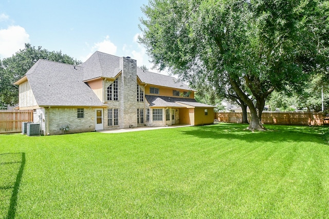 2622 Williams Grant St, Sugar Land, TX 77479 - back of house featuring a fenced backyard, a chimney, a patio area, brick siding, and roof with shingles