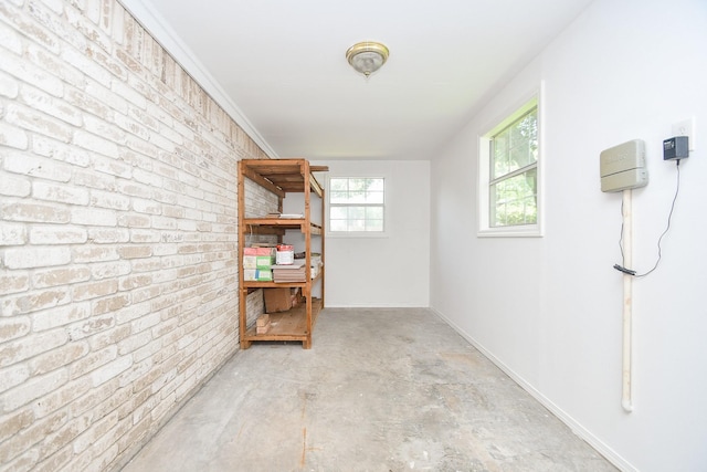 2622 Williams Grant St, Sugar Land, TX 77479 - basement featuring brick wall and baseboards