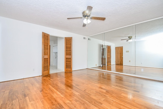 2622 Williams Grant St, Sugar Land, TX 77479 - unfurnished room featuring ceiling fan, light wood-style floors, and a textured ceiling