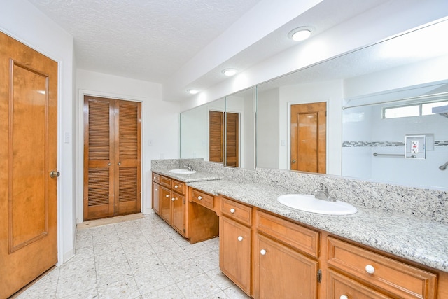 2622 Williams Grant St, Sugar Land, TX 77479 - bathroom featuring a closet, double vanity, and tile patterned floors