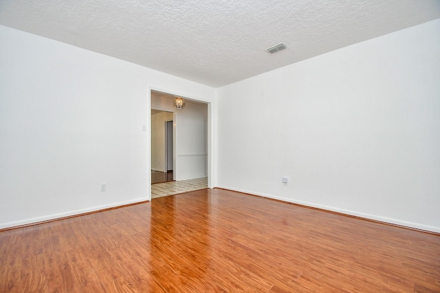 2622 Williams Grant St, Sugar Land, TX 77479 - unfurnished room with wood finished floors and a textured ceiling