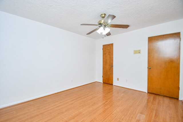 2622 Williams Grant St, Sugar Land, TX 77479 - empty room featuring light wood-style flooring, ceiling fan, and a textured ceiling