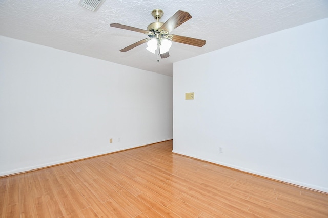 2622 Williams Grant St, Sugar Land, TX 77479 - spare room featuring light wood finished floors, ceiling fan, and a textured ceiling