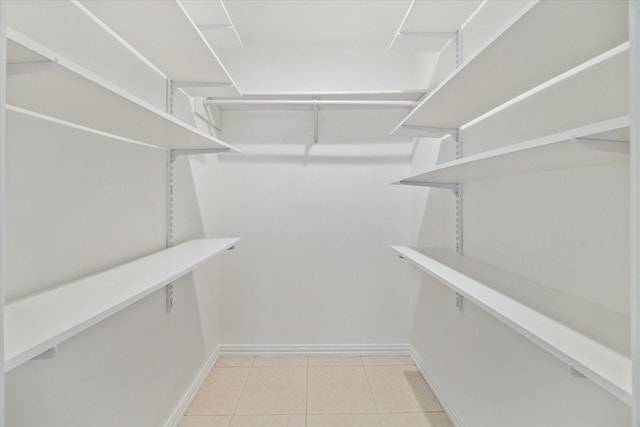4530 T C Jester Blvd, Houston, TX 77018 - walk in closet with light tile patterned flooring