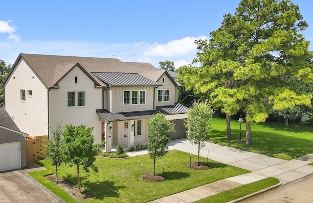 5317 Schumacher Ln, Houston, TX 77056 - modern farmhouse with a standing seam roof, concrete driveway, board and batten siding, a metal roof, and a front yard
