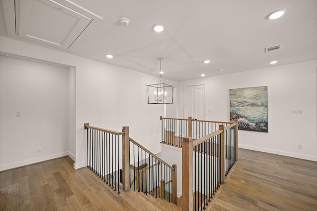 5317 Schumacher Ln, Houston, TX 77056 - corridor featuring an upstairs landing, recessed lighting, wood finished floors, and a chandelier