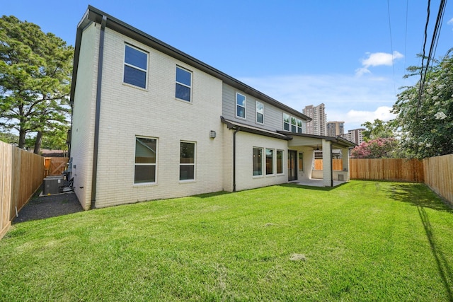 5317 Schumacher Ln, Houston, TX 77056 - rear view of house featuring brick siding, a fenced backyard, and a patio area