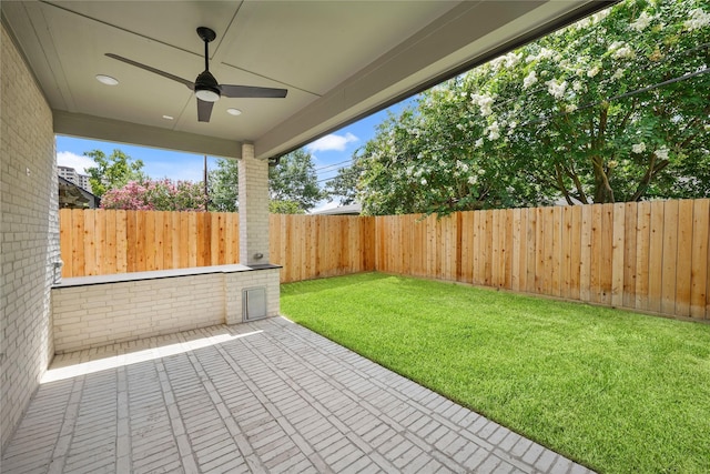 5317 Schumacher Ln, Houston, TX 77056 - fenced backyard featuring a ceiling fan and a patio area