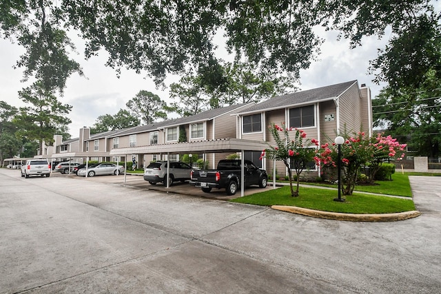 14911 Wunderlich Dr Unit 211, Houston, TX 77069 - view of building exterior with covered parking
