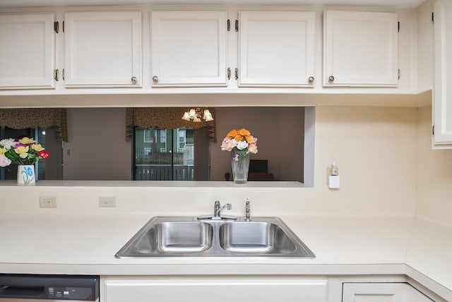 14911 Wunderlich Dr Unit 211, Houston, TX 77069 - kitchen with dishwashing machine, light countertops, and white cabinetry